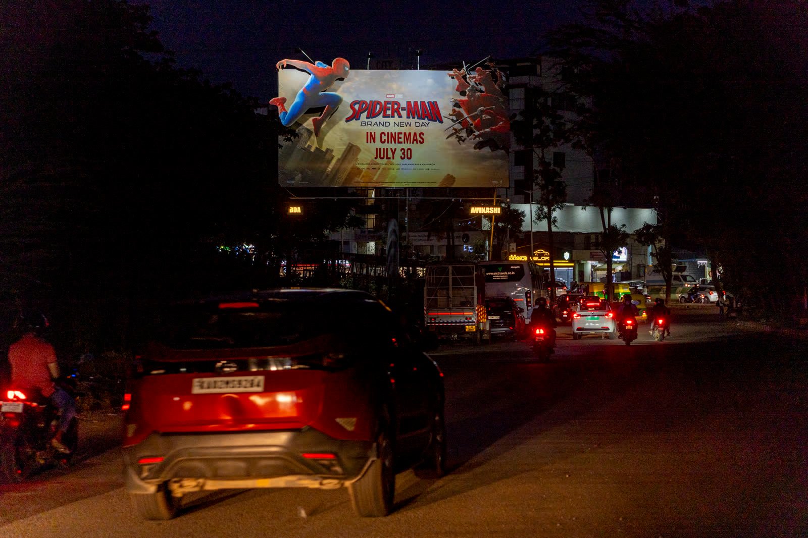 Bengaluru arterial-road hoarding illuminated at night